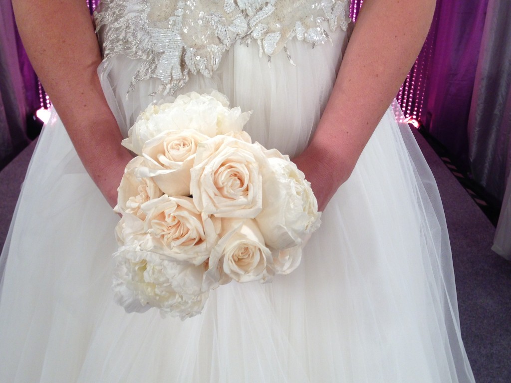 I kept the bouquet simple to ensure it would not distract from the beautiful appliques at the waistline.